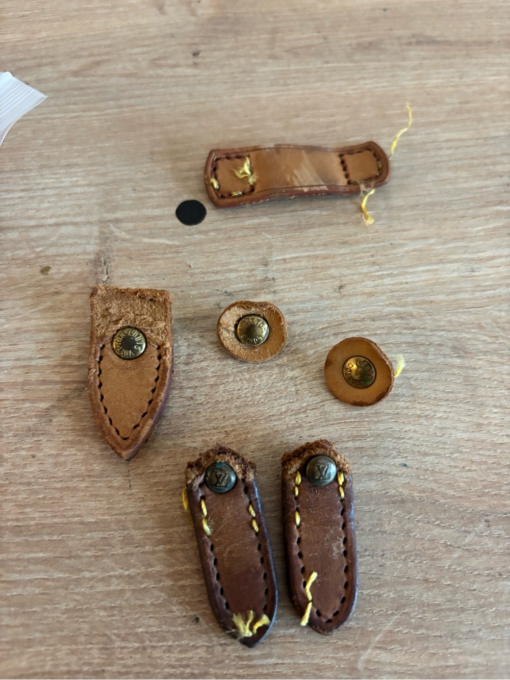 Authentic Louis Vuitton rivets snd leather tabs